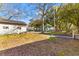 Lush backyard with mature trees, offering a serene outdoor space and potential for gardening at 1124 Berkeley St, Hanahan, SC 29410