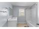 Bathroom featuring a bathtub with shower and ample counter space at 1124 Berkeley St, Hanahan, SC 29410