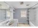 Bathroom with a shower-tub combo, vanity, and natural light, offering a space for renovation at 1124 Berkeley St, Hanahan, SC 29410