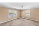 Inviting bedroom with natural light from two windows and neutral walls awaiting renovations at 1124 Berkeley St, Hanahan, SC 29410