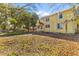 A two-story yellow house with lush landscaping, offering curb appeal and a welcoming entrance at 1124 Berkeley St, Hanahan, SC 29410