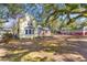 Charming two-story home with a brick addition surrounded by beautiful, mature trees at 1124 Berkeley St, Hanahan, SC 29410