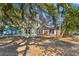 Charming two-story home with brick addition and mature trees, offering great curb appeal at 1124 Berkeley St, Hanahan, SC 29410