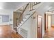 Foyer featuring hardwood floors, wooden staircase and white trim at 1124 Berkeley St, Hanahan, SC 29410