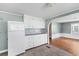 Bright kitchen featuring white cabinets, tiled backsplash, and tile floors at 1124 Berkeley St, Hanahan, SC 29410