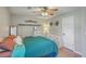 Comfortable bedroom featuring a ceiling fan, warm lighting and decor, and a nicely made bed at 114 Merrimack Blvd, Moncks Corner, SC 29461