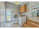 View of the laundry room area leading to the kitchen and backyard at 114 Merrimack Blvd, Moncks Corner, SC 29461