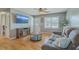 Comfortable living room with a plush sofa, entertainment center, and lots of natural light at 114 Merrimack Blvd, Moncks Corner, SC 29461