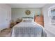 Inviting bedroom with natural light, featuring wood floors, a decorative wreath, and neutral color palette at 117 Tyger St, Summerville, SC 29485