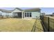 Cozy backyard with screened porch and fence in a modern planned community at 127 Garden Gate Way, Summerville, SC 29486