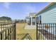 Fenced backyard featuring a covered porch, concrete patio and view of the community at 127 Garden Gate Way, Summerville, SC 29486