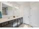 Bathroom features double sinks, vanity, and a white painted door at 127 Garden Gate Way, Summerville, SC 29486