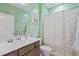 Bright bathroom features white countertops, dark cabinetry, and a framed mirror at 127 Garden Gate Way, Summerville, SC 29486