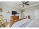 This bedroom has a wood bed frame, tv, and wooden dresser with lovely crown molding at 127 Garden Gate Way, Summerville, SC 29486