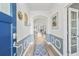 Bright entryway with hardwood floors, elegant wainscoting, and an inviting view into the open living space at 127 Garden Gate Way, Summerville, SC 29486