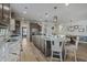 Open kitchen with granite counters, stainless steel appliances, hardwood floors, and dining area at 127 Garden Gate Way, Summerville, SC 29486