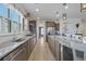Beautiful kitchen with stainless appliances, marble countertops, large kitchen island, and hardwood floors at 127 Garden Gate Way, Summerville, SC 29486
