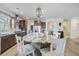 Bright kitchen with eat-in island, granite counters, stainless appliances, and hardwood flooring at 127 Garden Gate Way, Summerville, SC 29486