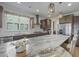 Elegant kitchen island with granite countertops, pendant lighting, and stainless steel appliances for modern living at 127 Garden Gate Way, Summerville, SC 29486