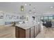 Open kitchen with large island, granite counters, stainless appliances, and hardwood flooring at 127 Garden Gate Way, Summerville, SC 29486