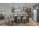 Spacious kitchen island with seating, pendant lights, and modern appliances in an open concept layout at 127 Garden Gate Way, Summerville, SC 29486