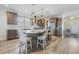 Spacious kitchen with eat-in island, granite counters, stainless appliances, and hardwood flooring at 127 Garden Gate Way, Summerville, SC 29486