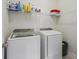 Convenient laundry room with modern washer and dryer, and plenty of shelving at 127 Garden Gate Way, Summerville, SC 29486