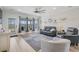 Open concept living room with a ceiling fan, sliding glass doors, and neutral decor at 127 Garden Gate Way, Summerville, SC 29486