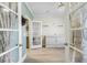 Bright living room with stylish flooring and French doors, creating an inviting space at 127 Garden Gate Way, Summerville, SC 29486