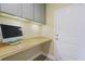 Functional office space with built-in desk, overhead cabinets, and ample workspace at 127 Garden Gate Way, Summerville, SC 29486