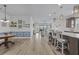 Open-concept living space featuring a kitchen island with bar seating, seamlessly flowing into the living area at 127 Garden Gate Way, Summerville, SC 29486