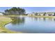 Scenic pond with a fountain, surrounded by lush greenery and beautiful homes at 127 Garden Gate Way, Summerville, SC 29486