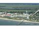 An aerial view of a coastal condo community with a pier, beach access, and ocean views at 1300 Ocean Blvd # 221, Isle of Palms, SC 29451