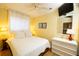 Bedroom with a ceiling fan, a large mirror, and a dresser at 1300 Ocean Blvd # 221, Isle of Palms, SC 29451