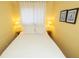 Bright bedroom featuring a comfortable bed with white linens and yellow walls at 1300 Ocean Blvd # 221, Isle of Palms, SC 29451