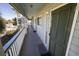 Exterior hallway showing unit 221 with well-maintained railings and access to stairways at 1300 Ocean Blvd # 221, Isle of Palms, SC 29451