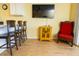 Bright living room with hardwood floors, a flatscreen TV, and stylish seating arrangements at 1300 Ocean Blvd # 221, Isle of Palms, SC 29451