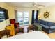 Inviting living area featuring comfortable seating, a ceiling fan, and sliding glass doors to a balcony at 1300 Ocean Blvd # 221, Isle of Palms, SC 29451