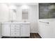 Bright bathroom featuring double sinks with white cabinets and a tiled walk-in shower at 1326 Black Tom Rd, Moncks Corner, SC 29461