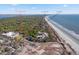 Stunning aerial view showcasing the property's location near the beach, lush greenery, and community amenities at 1407 Shipwatch Rd, Kiawah Island, SC 29455