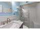 Charming bathroom with a marble countertop, updated fixtures, and glass shower at 1407 Shipwatch Rd, Kiawah Island, SC 29455