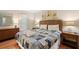 Cozy bedroom featuring a comfortable bed, wicker headboard, and nautical themed decor at 1407 Shipwatch Rd, Kiawah Island, SC 29455