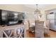 Charming dining area featuring a wooden table and wicker chairs with hardwood floors and a decorative wooden cabinet at 1407 Shipwatch Rd, Kiawah Island, SC 29455
