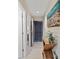 Hallway with console table and view to front door with an attractive painting on the wall at 1407 Shipwatch Rd, Kiawah Island, SC 29455