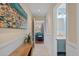 Inviting hallway with stylish decor leading to a bright living area and a well-appointed bathroom at 1407 Shipwatch Rd, Kiawah Island, SC 29455