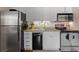 Well-equipped kitchen featuring granite countertops, stainless steel appliances, and white cabinets with ample storage space at 1407 Shipwatch Rd, Kiawah Island, SC 29455