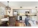 Well-lit open floor plan with a kitchen, stainless steel appliances, and a round dining table at 1407 Shipwatch Rd, Kiawah Island, SC 29455