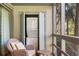 Convenient laundry area with stacked washer and dryer, located just off the screened porch with a comfortable sitting area at 1407 Shipwatch Rd, Kiawah Island, SC 29455