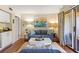 Comfortable living room with white kitchen cabinets, a small table, and views of the outdoor patio at 1407 Shipwatch Rd, Kiawah Island, SC 29455