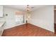 A vintage dining room with wood-look flooring, floral wallpaper, double doors, and a decorative chandelier at 1452 Glencoe Dr, Mount Pleasant, SC 29464